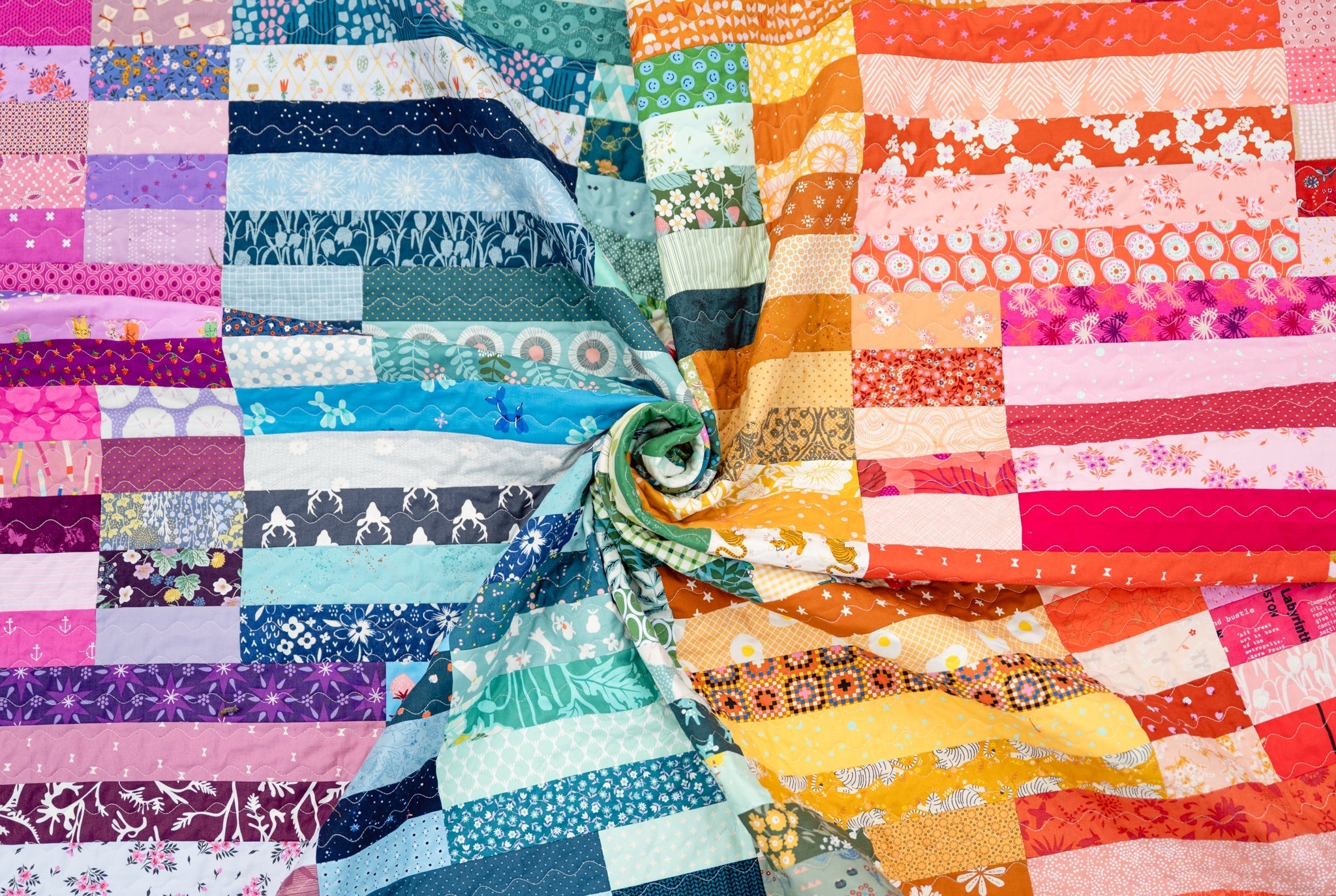The Zora Quilt in a Rainbow of Scraps – Kitchen Table Quilting