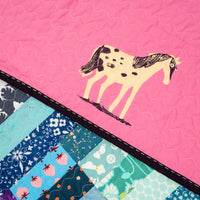 The Zora Quilt in a Rainbow of Scraps