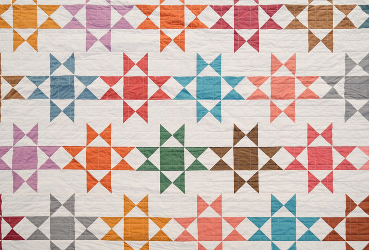 The Zelda Quilt pattern uses a beautiful collection of solids from Art Gallery Fabric's Pure solids to make this traditional, fat quarter friendly pattern feel a little more modern. 