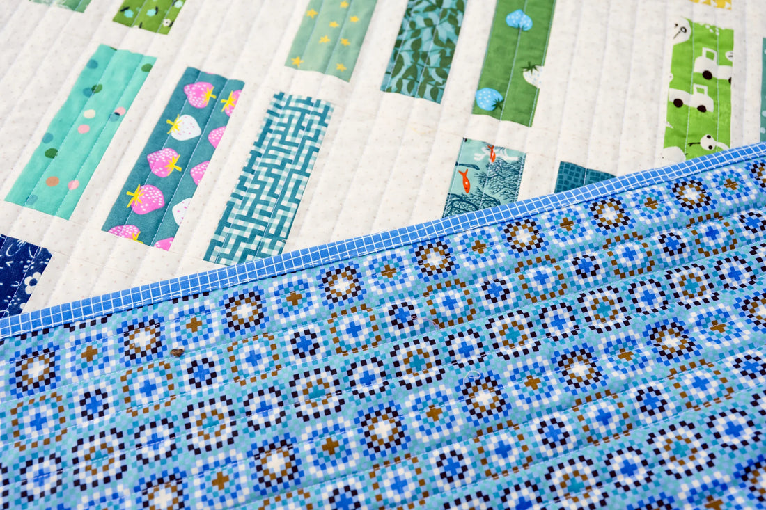 A Scrappy, Rainbow, Ruby Star Society Natalie Quilt