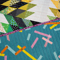 A Scrappy, Rainbow Dylan Quilt